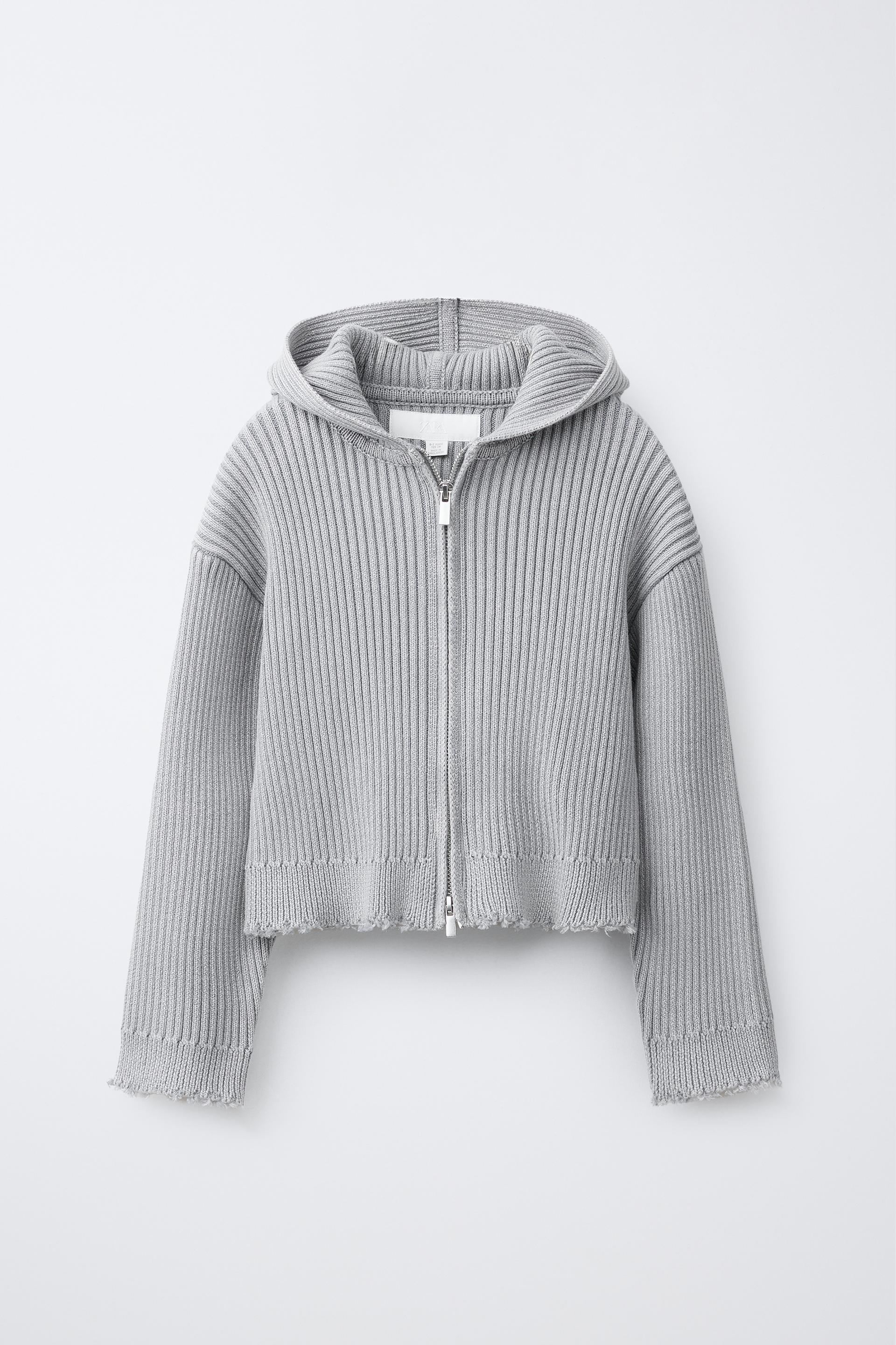 Year-round versatile knitwear collection featuring ribbed zip hoodie